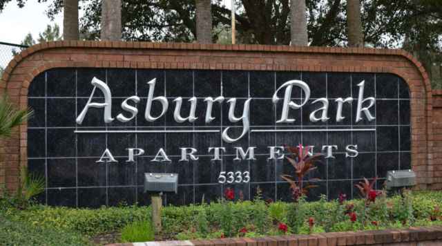 Front sign at Asbury Park. Monument sign visible from the street so that passing vehicles can identify the community.